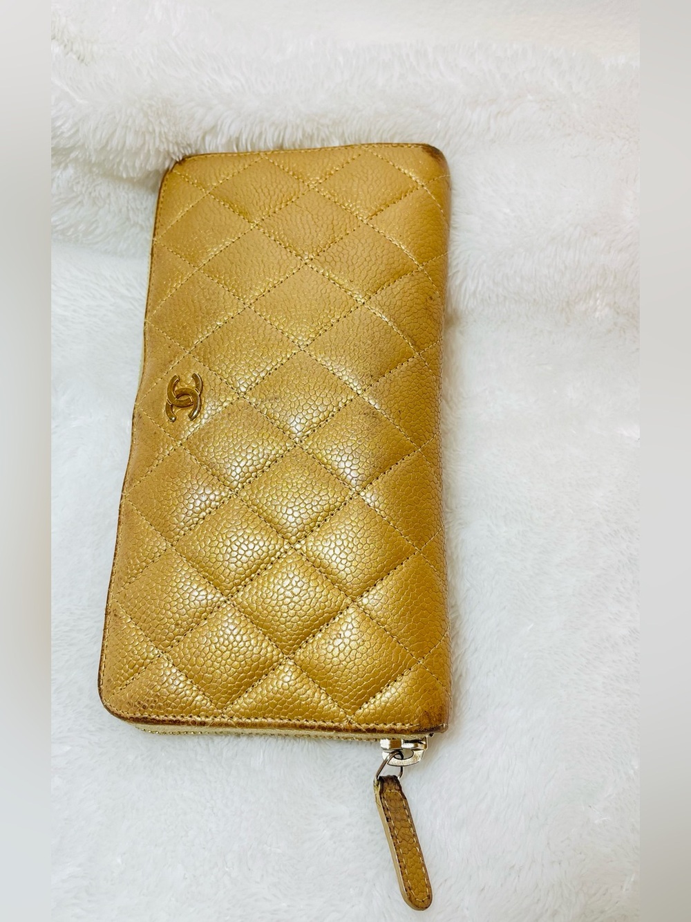 CHANEL Authentic Caviar Quilted Zip Wallet in Metallic Gold-Tone